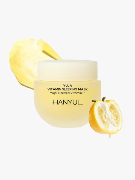 Hanyul Yuja Vitamin Sleeping Mask in yellow jar with lemon and swatch on light grey background